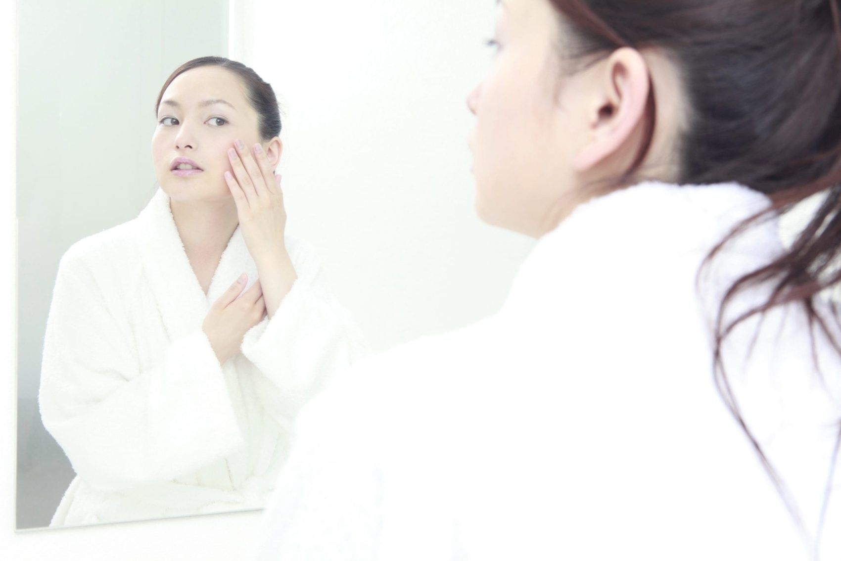 A woman applying Skin care