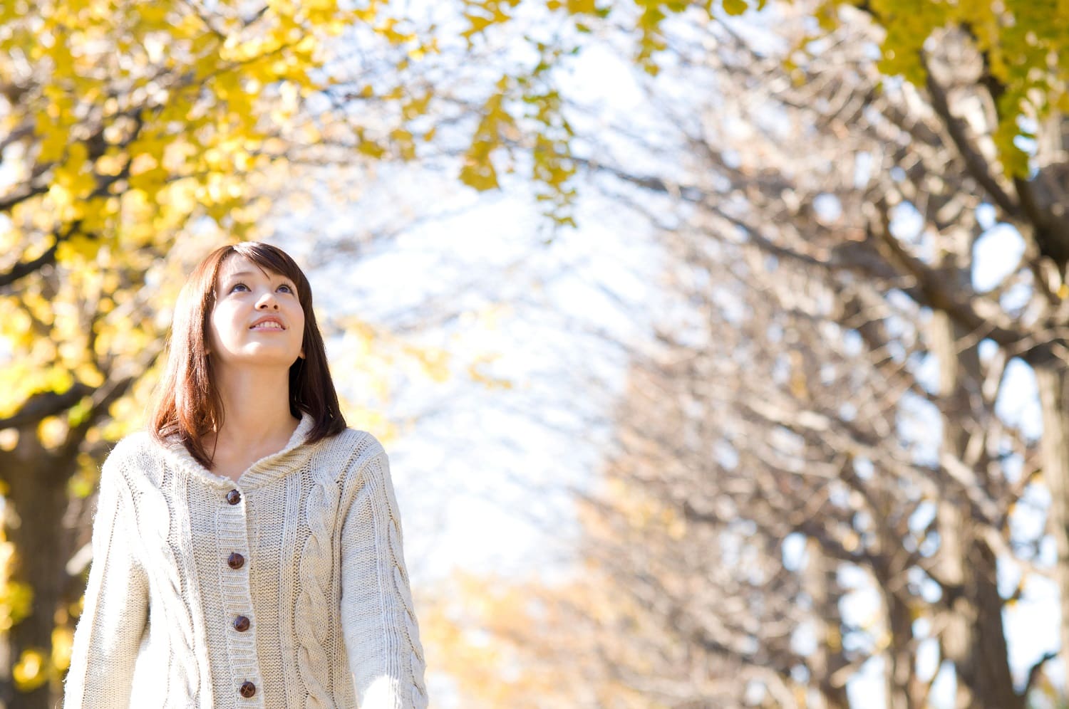 Woman walking in the park - breathing fresh air