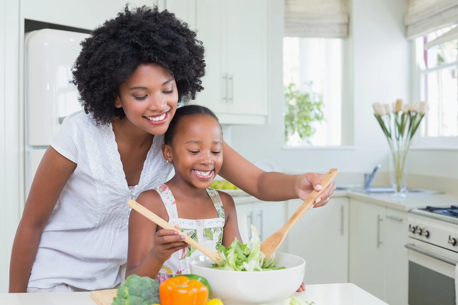 Mom and daughter are preparing a healthy food for lunch