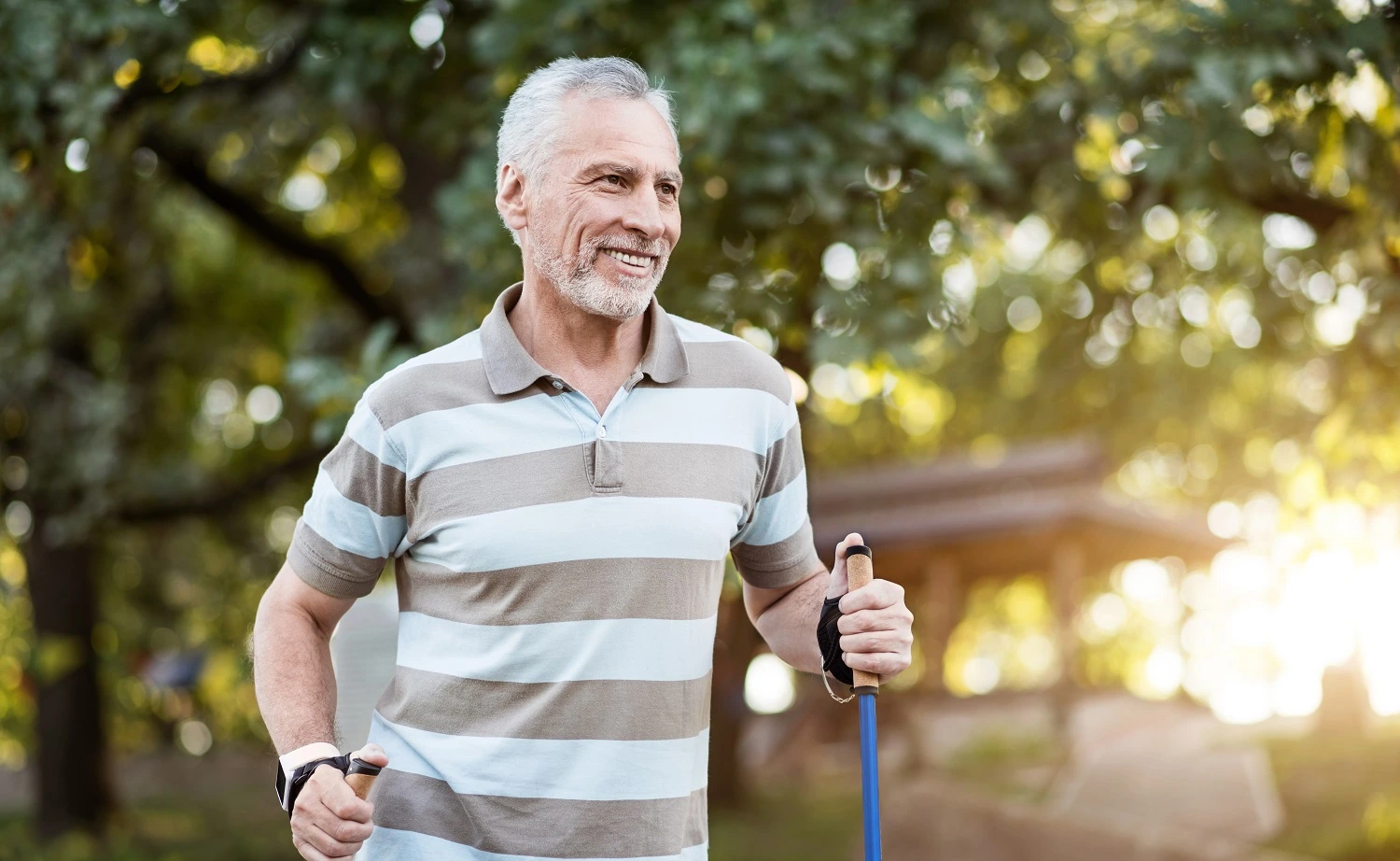 Healthy man jogging in the park in a sunny day