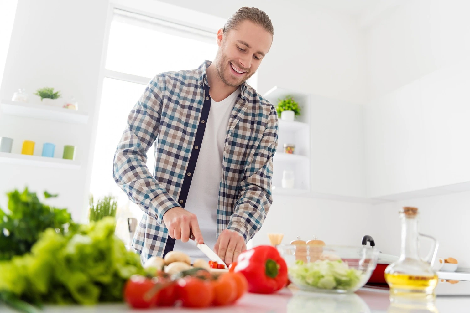 Man in the kitchen preparing a healthy breakfast as mornign routine