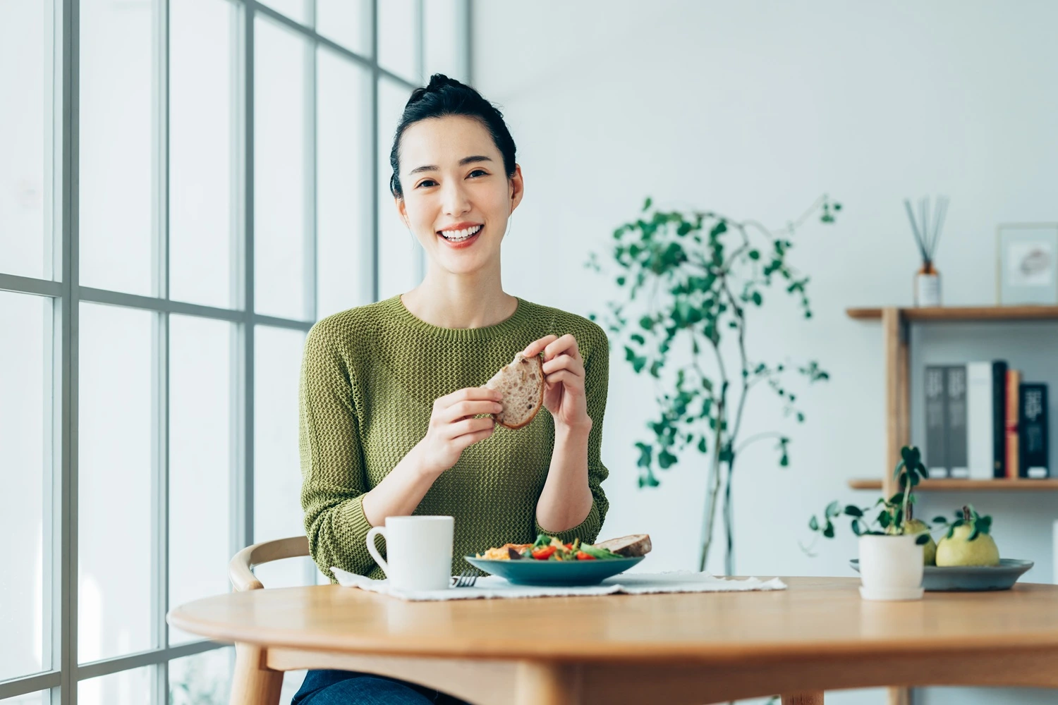 Asian woman eating a healthy breakfast